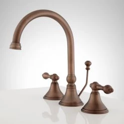 Signature Hardware Melanie 1.2 GPM Widespread Bathroom Faucet with Small Metal Lever Handles and Pop-up Drain Assembly 7 Signature Hardware Melanie 1.2 GPM Widespread Bathroom Faucet with Small Metal Lever Handles and Pop-up Drain Assembly -Central Brass store signature hardware 918898 side view 97
