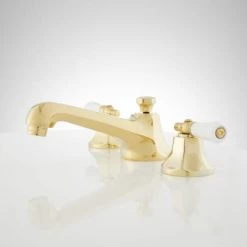 Signature Hardware New York 1.2 GPM Widespread Bathroom Faucet with Porcelain Lever Handles and Pop-up Drain Assembly 10 Signature Hardware New York 1.2 GPM Widespread Bathroom Faucet with Porcelain Lever Handles and Pop-up Drain Assembly -Central Brass store signature hardware 918901 side view 110