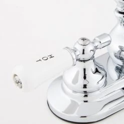 Signature Hardware Teapot Centerset Bathroom Faucet with Small Porcelain Lever Handles and Pop-Up Drain Assembly -Central Brass store signature hardware 918942 handle close up view 403