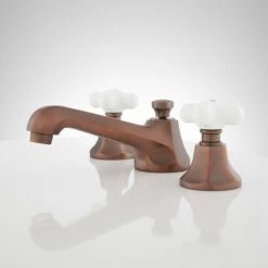 Signature Hardware New York 1.2 GPM Widespread Bathroom Faucet with Porcelain Cross Handles and Pop-up Drain Assembly -Central Brass store signature hardware 940032 side view 314