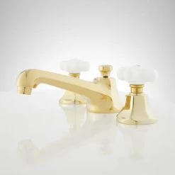 Signature Hardware New York 1.2 GPM Widespread Bathroom Faucet with Porcelain Cross Handles and Pop-up Drain Assembly -Central Brass store signature hardware 940032 side view 315